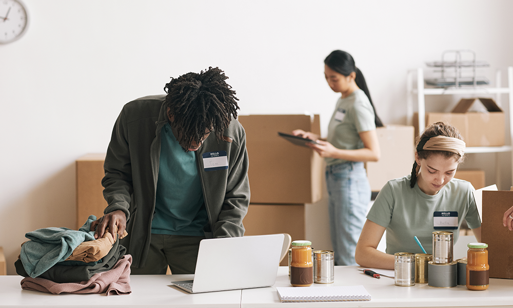 Charity Workers On Laptop