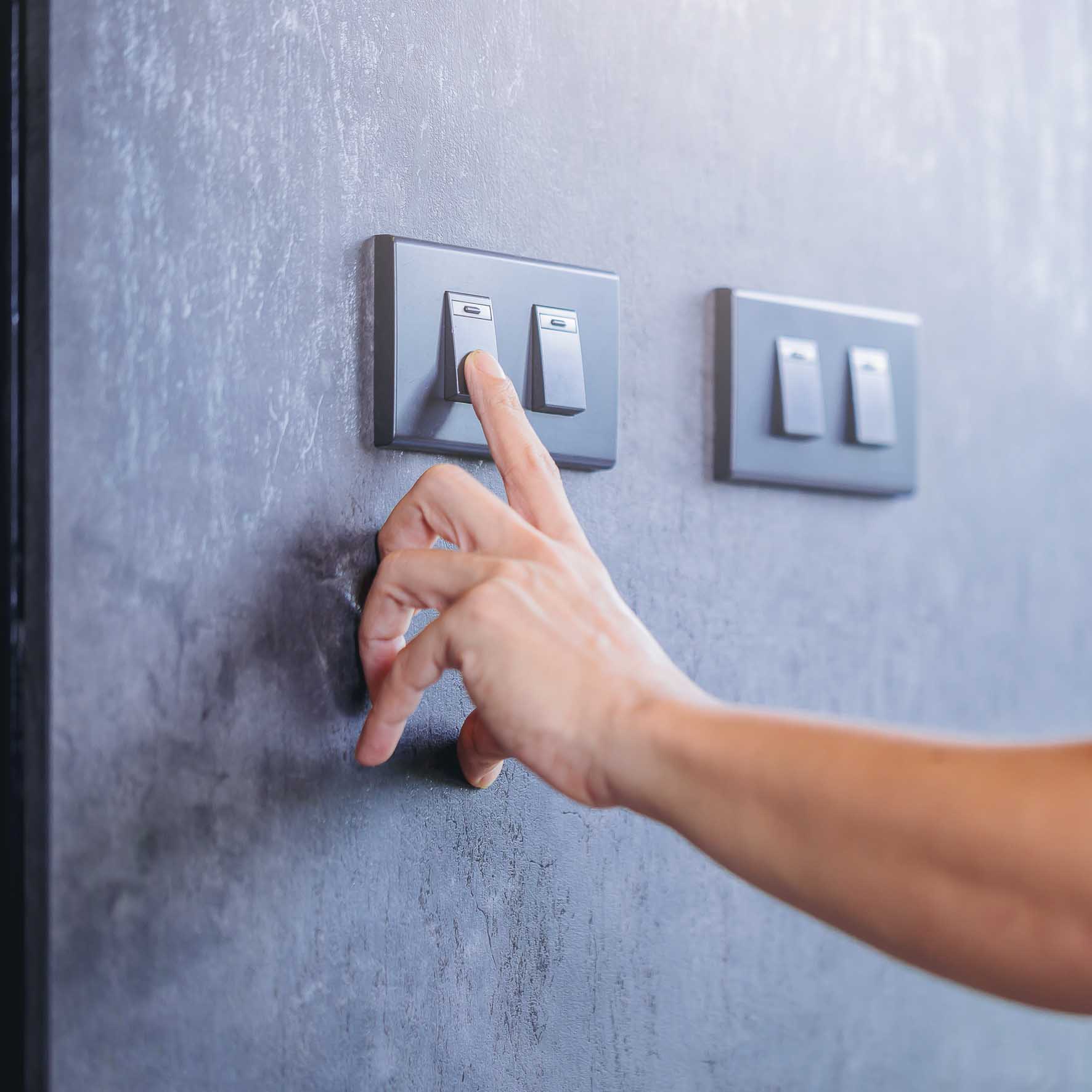 Man switching off light