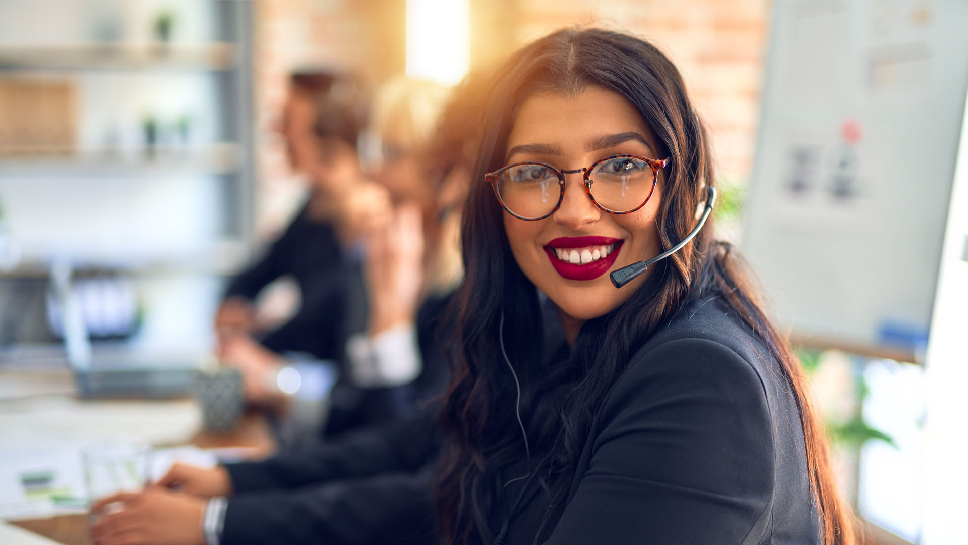 Female customer service assistant smiling at camera