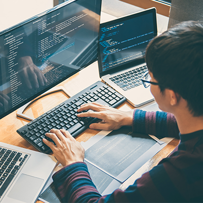 Man Hacking On Laptop