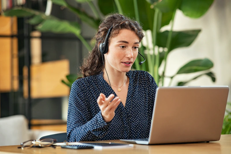 Woman On Phone On Laptop