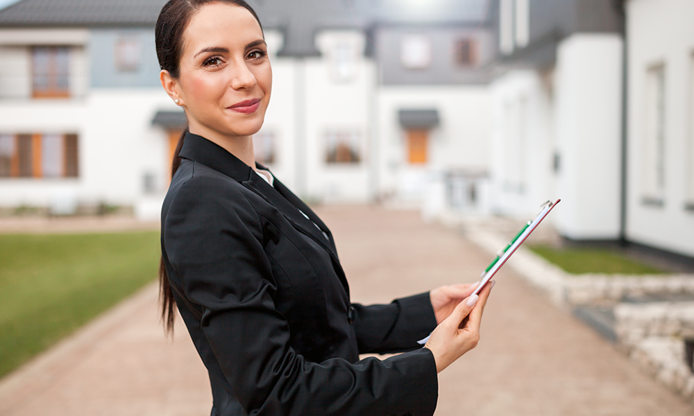 woman in front of houses