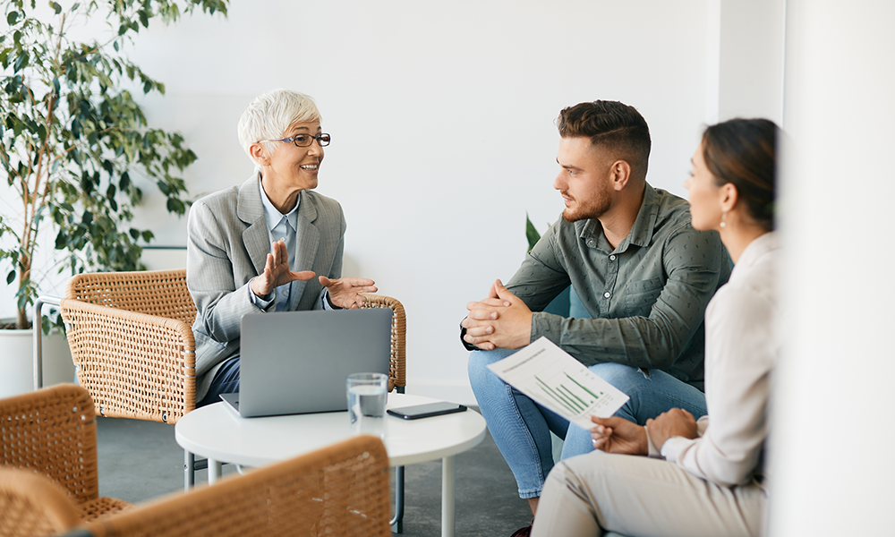 Women and Couple Discussing On Laptop