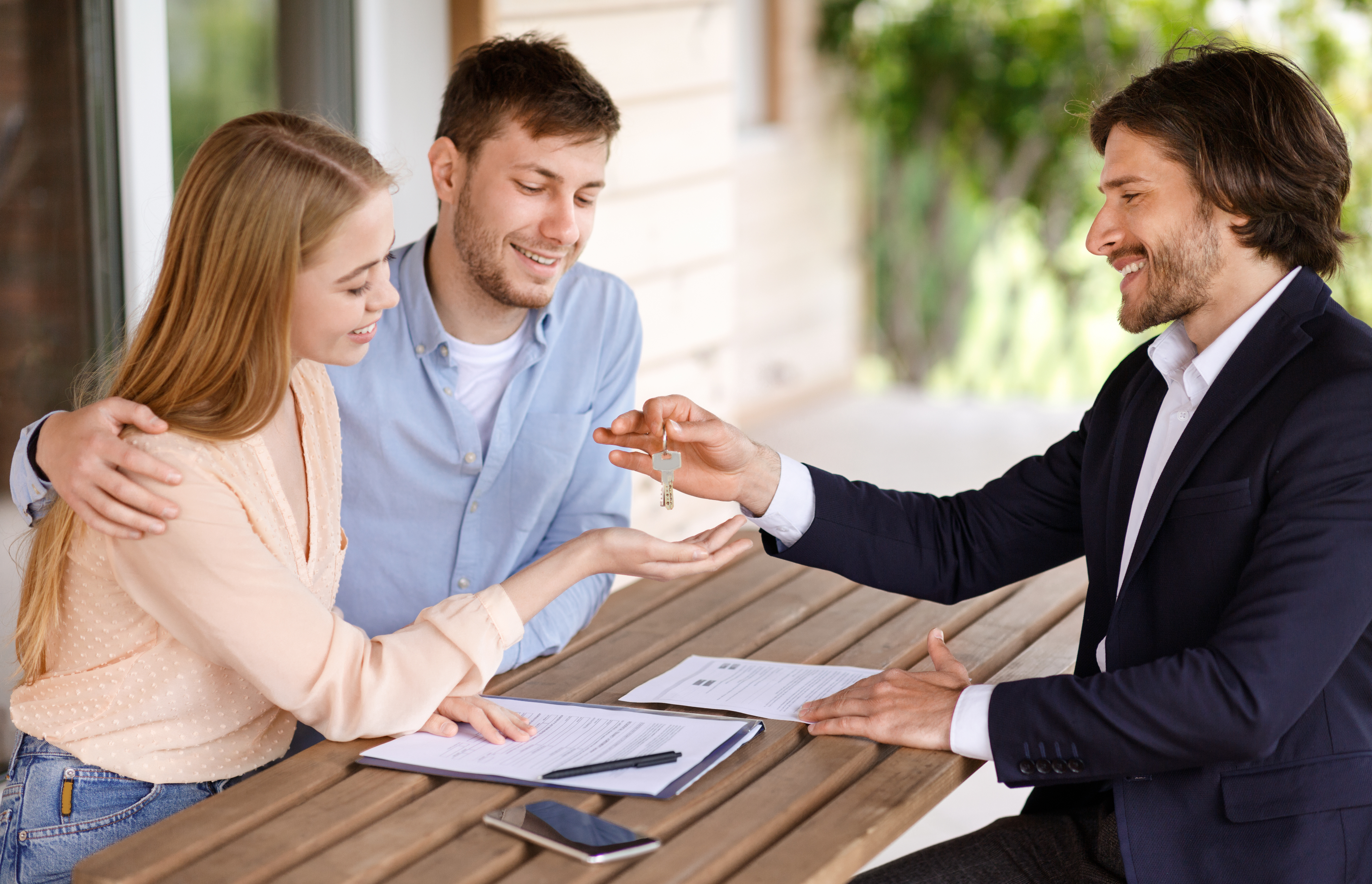 Estate Agent Handing Over Keys